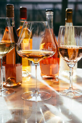 Different types of wine in glasses - red, white, rose and amber. Wine tasting in a bar or restaurant.