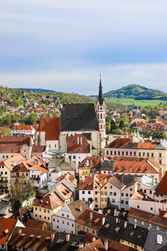 Cesky Krumlov, Czech Republic. Scenic Panorama of old town with view at roofs of houses and St Vitus cathedral.UNESCO World Heritage Site