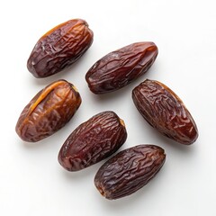 Pile of Dried Dates on White Background