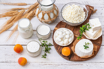 Fresh dairy products, milk, cottage cheese,  yogurt, kefir, feta cheese on kitchen table