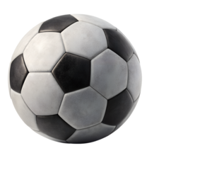 A classic black and white soccer ball captured in dynamic motion with dust, perfect for themes of sport, competition, action, and athletic energy.