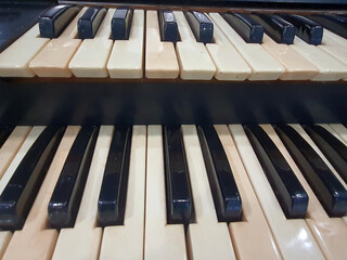 Close up of old organ keyboard.