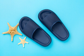 Blue sandals on color background,top view