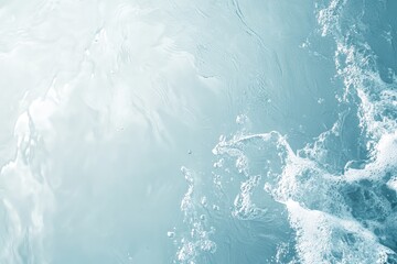 Light-blue water surface with ripples and splashes