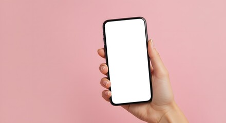 Hand holding smartphone with blank screen on pink background