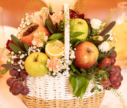 basket with fruits and flowers