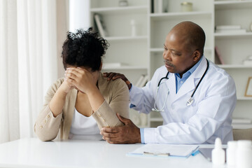 Bad Diagnosis. Doctor Man Comforting Depressed Female Patient During Appointment In Clinic, Black Physician Male Supporting Upset Woman After Sharing Test Results, Expressing Empathy, Closeup
