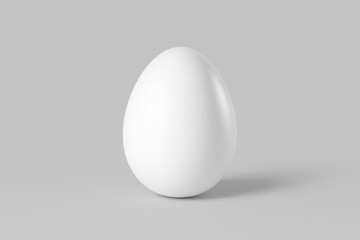 White egg on gray background. ideal for food, design, or Easter themed concepts