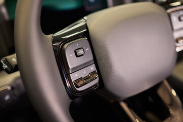 The modern cars steering wheel control panel boosts convenience and performance