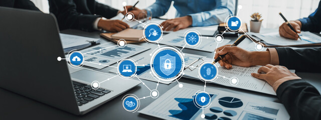 A professional setting shows a team engaged in data management strategies, utilizing technology and...