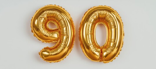 Elegant golden balloon numbers 90 on a minimalist white background