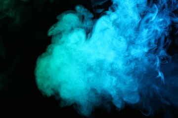 Beautiful smoke in neon lights on dark background