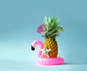 Pink inflatable flamingo and pineapple. Summer pool float party idea. Summer concept.