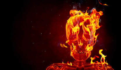Burning skull on a black background. Slow motion fire flames with sparks.