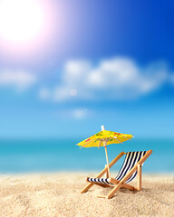 Beach chairs on the gold sand beach with umbrella, cloudy blue sky and sun