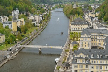 Panoramic aerial view of Bad Ems, the historic spa town on the Lahn River in Rhineland-Palatinate, Germany, nestled between wooded hills and renowned for its UNESCO World Heritage spa architecture.