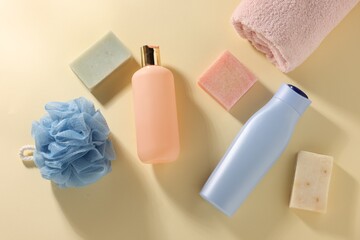 Different bath accessories on yellow background, flat lay