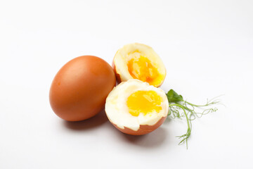 Soft boiled eggs and microgreens on white background