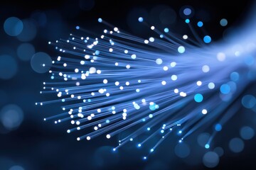 Fototapeta premium Fiber optic cables glowing on dark background transmitting data through optical fibers