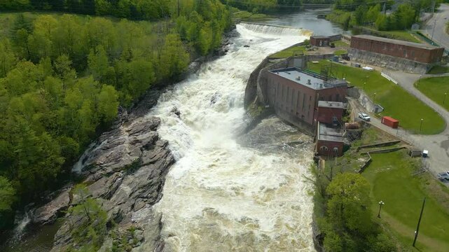 Aerial View of Hydroelectric Dam and Waterfall in Maine Forest, drone 4K