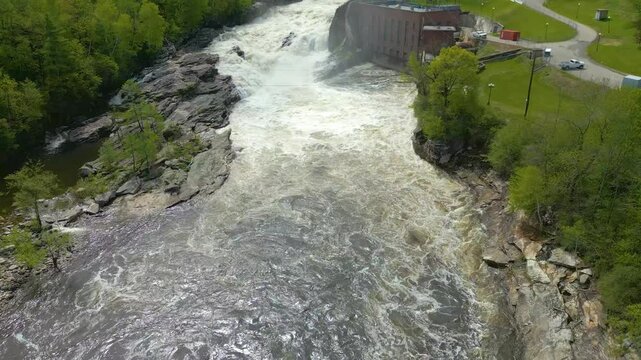 Aerial View of Hydroelectric Dam and Waterfall in Maine Forest, drone 4K