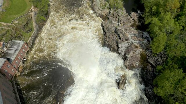 Aerial View of Hydroelectric Dam and Waterfall in Maine Forest, drone 4K