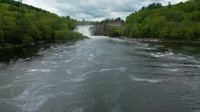 Aerial View of Hydroelectric Dam and Waterfall in Maine Forest, drone 4K