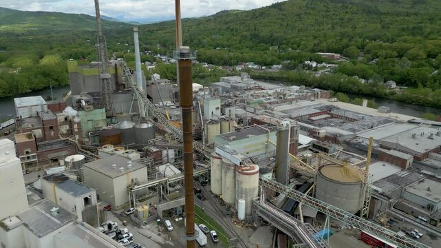 Aerial View of Industrial Paper Mill and Wood Processing Plant in Maine, drone 4k