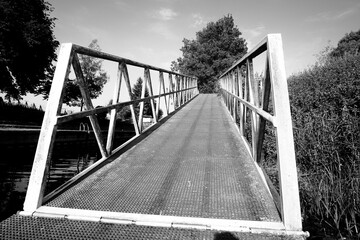 Narrow steel footpath bridge example
