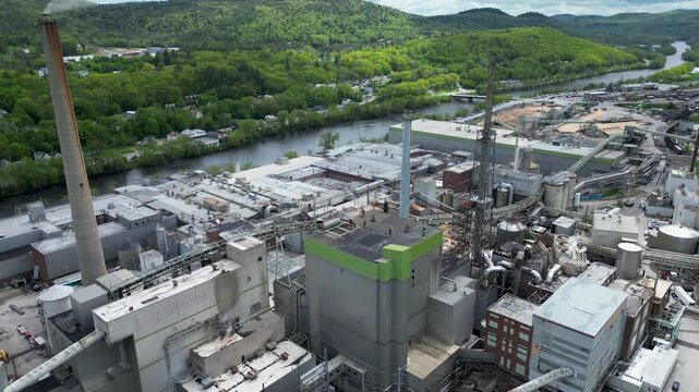Aerial View of Industrial Paper Mill and Wood Processing Plant in Maine, drone 4k
