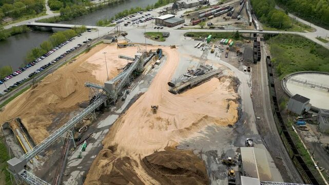 Aerial View of Industrial Paper Mill and Wood Processing Plant in Maine, drone 4K