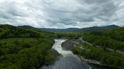 Aerial View of Hydroelectric Dam and Waterfall in Maine Forest