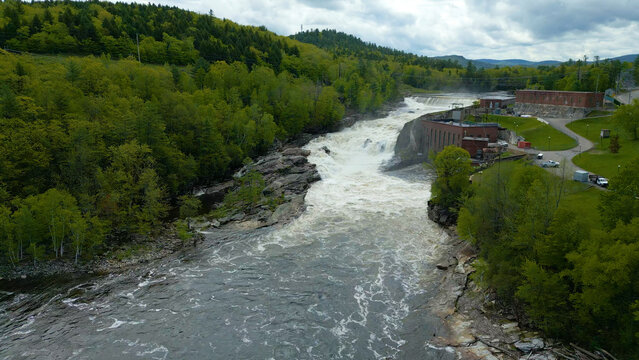 Aerial View of Hydroelectric Dam and Waterfall in Maine Forest