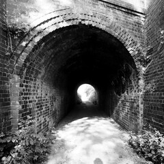 Old brick railway tunnel in Black and White