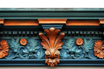 A detailed shot of architectural trim featuring ornate floral and acanthus leaf carvings in teal and orange.