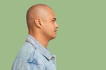 Obraz premium Bald young man on green background