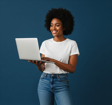 Full body young smiling happy black woman in casual clothes shirt white t-shirt hold use work on laptop pc computer look aside isolated on plain dark blue background studio. People lifestyle concept
