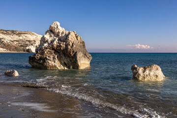 Rock Aphrodite beach, Cyprus Mediterranean sea coastline with breaking waves. Sea cliffs in water