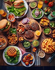 Fototapeta premium Sommerliches BBQ mit saftigen Burgern, frischen Salaten und herzhaften Snacks – gedeckter Holztisch aus der Draufsicht.