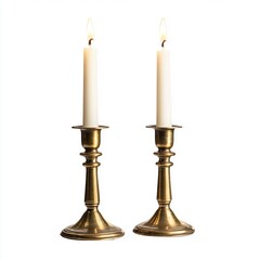 Two brass candle holders, each holding a lit white candle