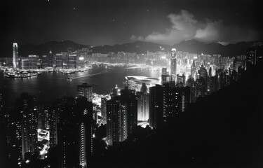 The view of Hong Kong's skyline at night, including the sea and skyscrapers The city lights create an enchanting atmosphere with colorful hues in the sky Generative AI