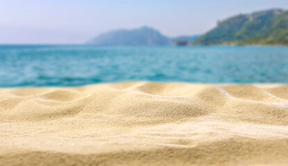 Beach Sand Close-Up with Copy Space – Summer Background for Product Placement. Sunlit beach sand...