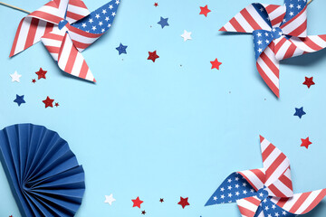 Fototapeta premium Pinwheels made of USA flags and stars on blue background. Independence Day celebration