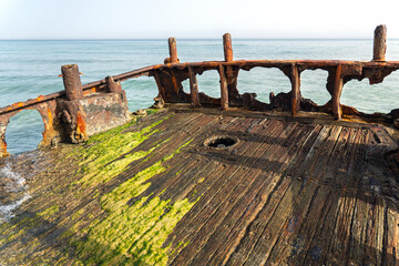 Rusty stern of shipwreck on the Shore of the Mediterranean Sea