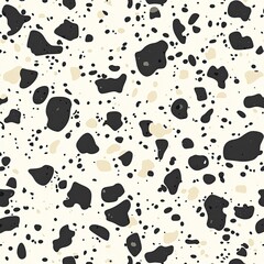 Abstract terrazzo pattern with black, beige, and white speckled design
