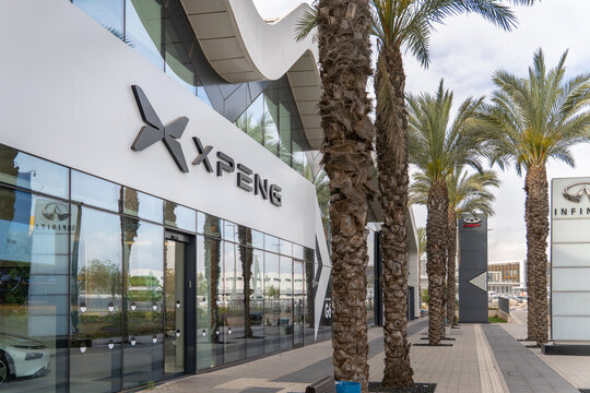 Rishon Lezion, Israel - May 15,2025. Xpeng Motors electric car store with palm trees in Israel. A Chinese electric vehicle manufacturer
