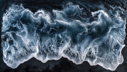 Dark ocean waves crashing on shore