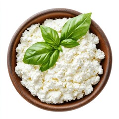 Creamy ricotta cheese in a brown bowl, topped with fresh basil leaves (1)