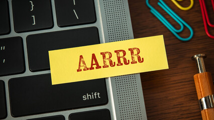 There is sticky note with the word AARRR. It is an abbreviation for Acquisition, Activation, Retention, Referral, Revenue as eye-catching image.