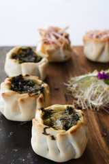Catering service for events. Hot finger food. Closeup view of crispy vegetables and cheese and ham empanadas called canastitas	
